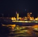 USS Bonhomme Richard (LHD 6) conducts nighttime replenishment at sea