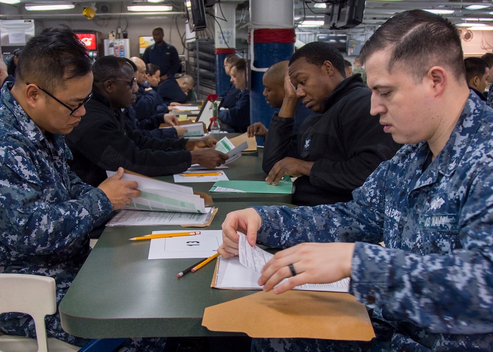 Sailors participate in the Navywide advancement exams aboard USS Bonhomme Richard (LHD 6)