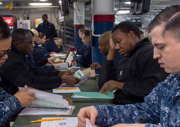 Sailors participate in the Navywide advancement exams aboard USS Bonhomme Richard (LHD 6)