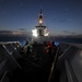 U.S. Coast Guard Cutter Mellon patrols at night during Operation North Pacific Guard