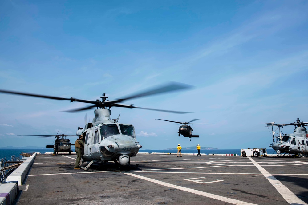 U.S. Army lands helicopters on USS Green Bay’s flight deck during Cobra Gold