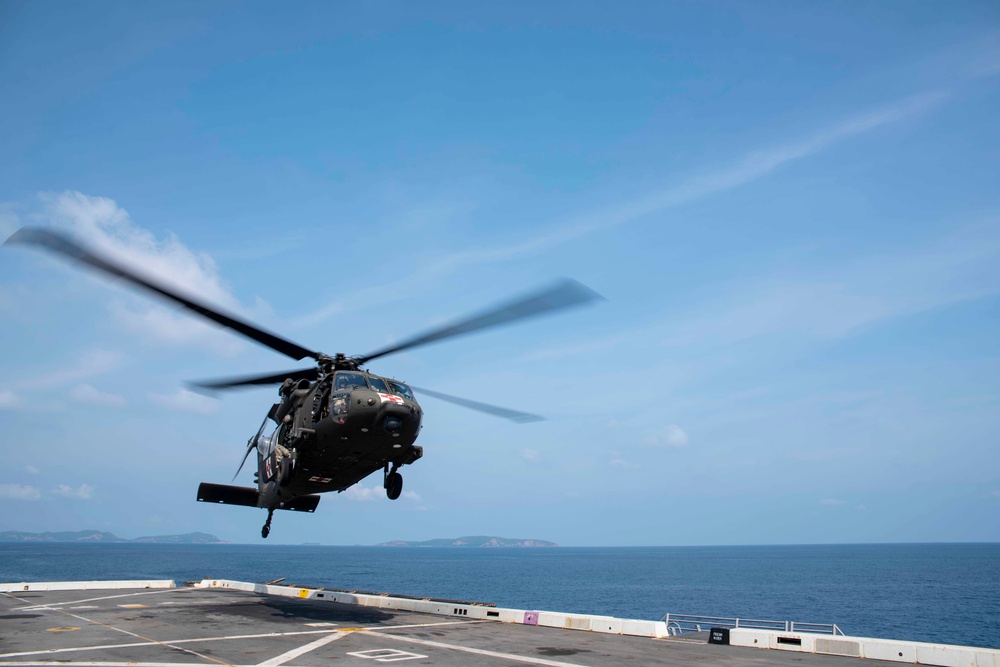 U.S. Army lands helicopters on USS Green Bay’s flight deck during Cobra Gold