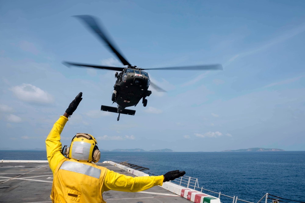 U.S. Army lands helicopters on USS Green Bay’s flight deck during Cobra Gold