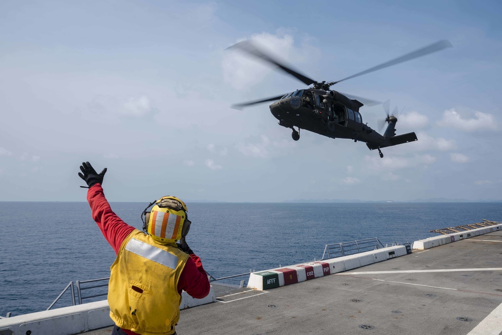 U.S. Army lands helicopters on USS Green Bay’s flight deck during Cobra Gold