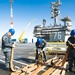 Albert Mendez and Mates Perform Maintenance on a Hose of an Aqueous Film Forming Foam (AFFF) Station