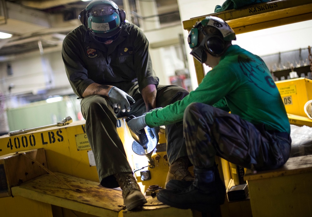 Forklift maintenance aboard USS Bonhomme Richard (LHD 6)
