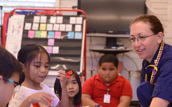 Coast Guard members read to Kalihi Elementary students