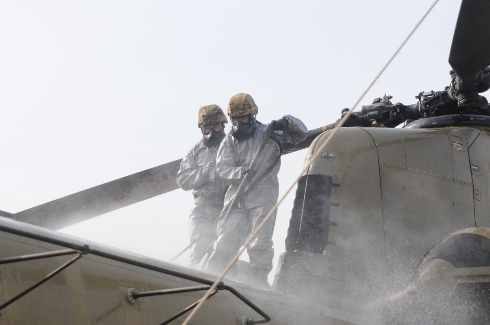 Decon operations on the roof of a Chinook