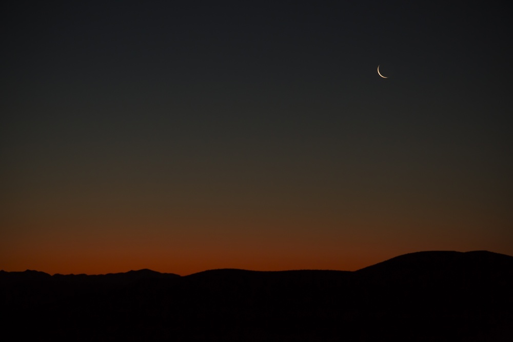 Crescent Moon Over Sunrise