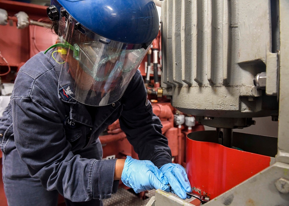 USS Wayne E. Meyer Sailor Performs Engine Maintenance