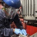 USS Wayne E. Meyer Sailor Performs Engine Maintenance