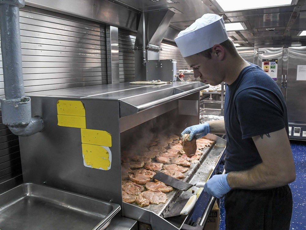 USS Wayne E. Meyer Sailor Prepares Dinner