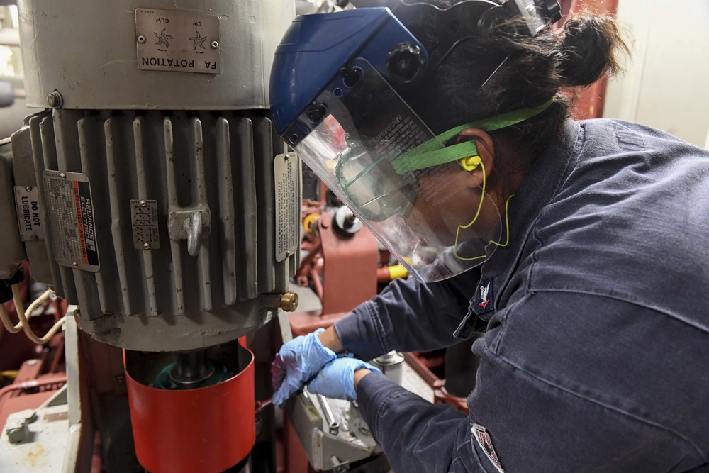 USS Wayne E. Meyer Sailor Performs Engine Maintenance