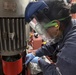 USS Wayne E. Meyer Sailor Performs Engine Maintenance