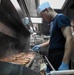 USS Wayne E. Meyer Sailor Prepares Dinner