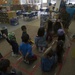 Marines read to children at Zukeren Elementary for Read Across DoDEA Day