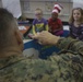 Marines read to children at Zukeren Elementary for Read Across DoDEA Day