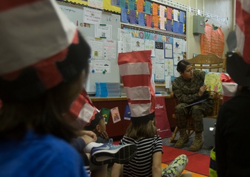 Marines read to children at Zukeren Elementary for Read Across DoDEA Day