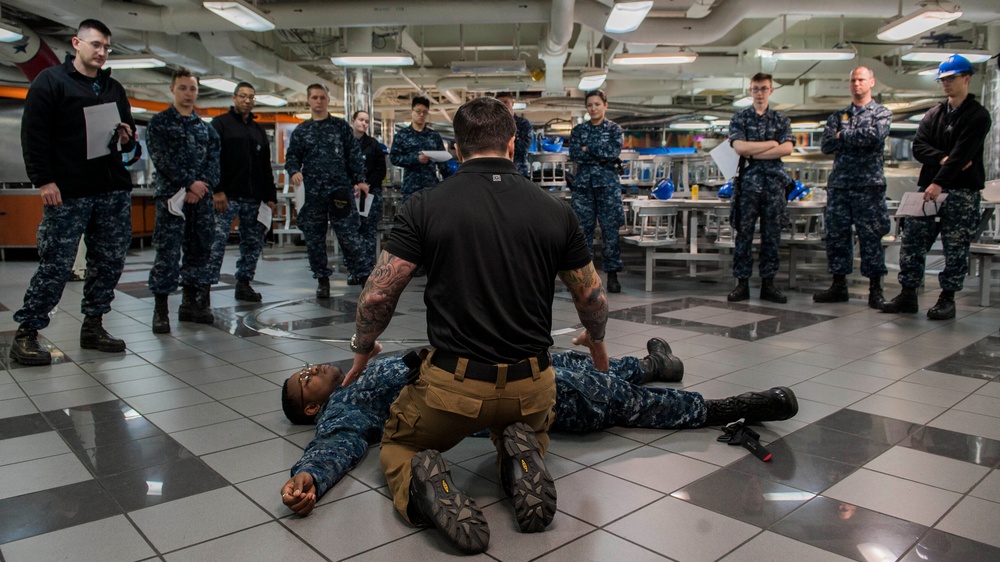 U.S. State Department Senior Medical Instructor Teaches Sailors How To Assess An Unconscious Patient