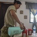 Army Sgt. Katia Rivera sterilizes surgical utensils before a veterinary procedure