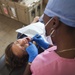 Honduran dentist performs dental work on a host nation patient at Continuing Promis