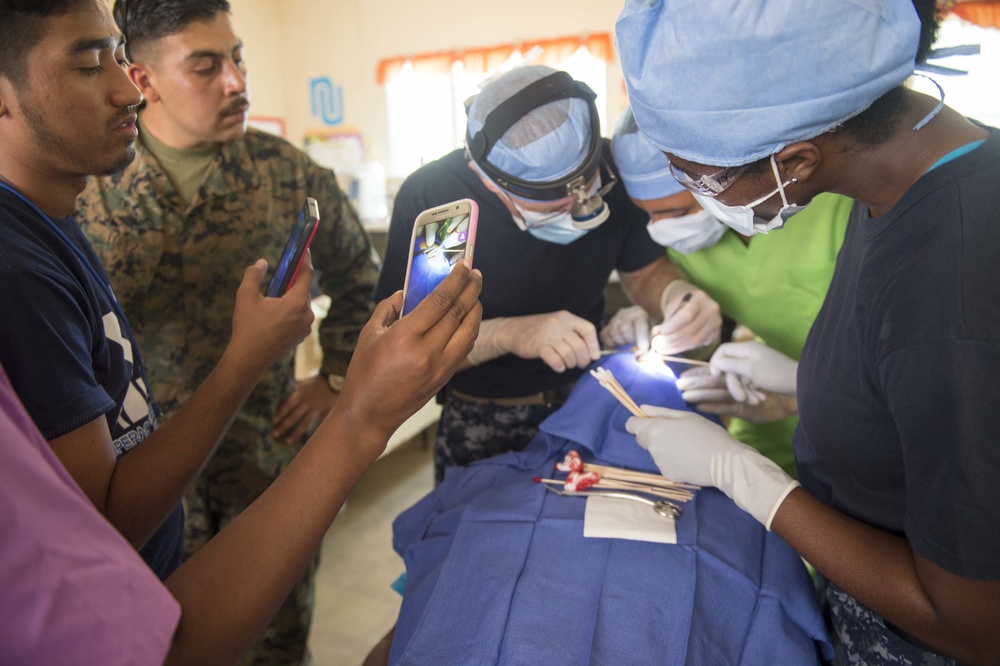 Cmdr. Christopher Crecelius Performs Surgery On The Eyelid of A Host Nation Patient at Continuing Promise 2017