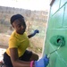 Logistics Specialist 2nd Class Paints The Walls of A Honduran Elementary School