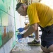 Lt. Cmdr. Don Rogers Paints The Walls of A Honduran Elementary School