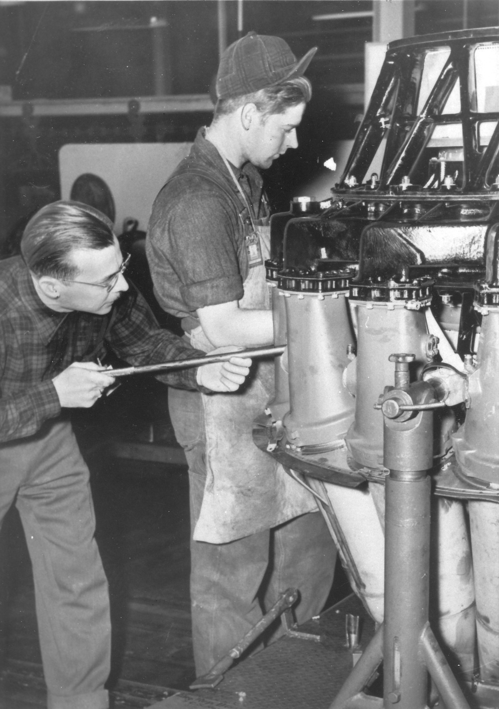 Mechanics work on Allison J33 jet engine at Tinker Air Force Base, Oklahoma