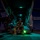 A military crew member in full flight gear sits at the open rear ramp of what appears to be a V-22 Osprey tiltrotor aircraft during nighttime operations. The scene is dramatically lit by a green light emanating from beneath the ramp, illuminating the tarmac and the interior of the aircraft. A mounted crew-served weapon is visible to the left side of the ramp opening.