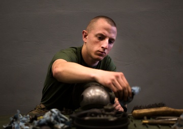 Artillerymen maintain their guns