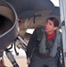 Pilot inspects her fighter jet