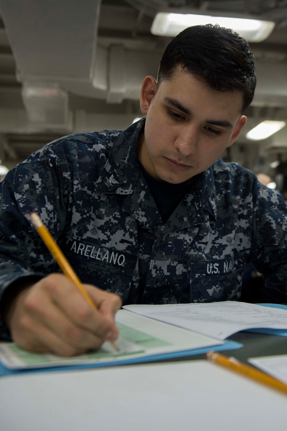 Electronics Technician 3rd Class Ricardo Arellano Participates in Navywide E-5 Advancement Exam