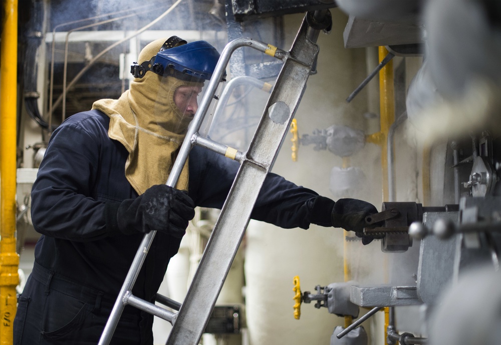 Engineering department boiler maintenance and nightly oil check aboard USS Bonhomme Richard