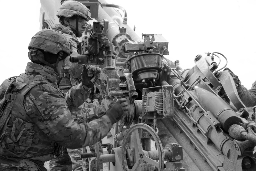 2nd Cav. Regt. artillery gun crews mass fire with NATO Allies