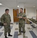 Rear Adm. Luscher Tours Uniform Fitting Facility at ECRC