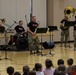 ‘Big Red One’ Brass Band perform during Music In Our Schools month