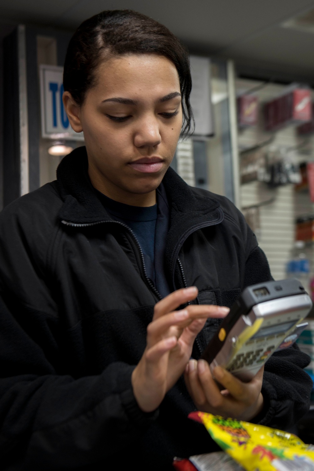 Ship's Serviceman Completes Transaction