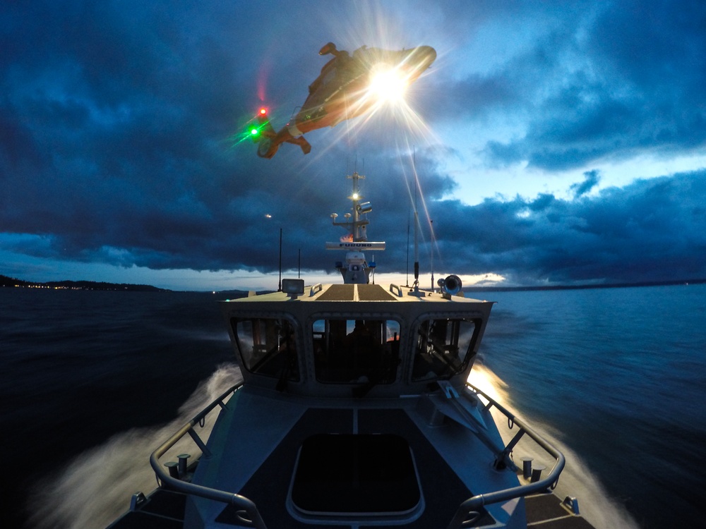 Coast Guard units conduct night time helo ops in Elliott Bay, Wash.