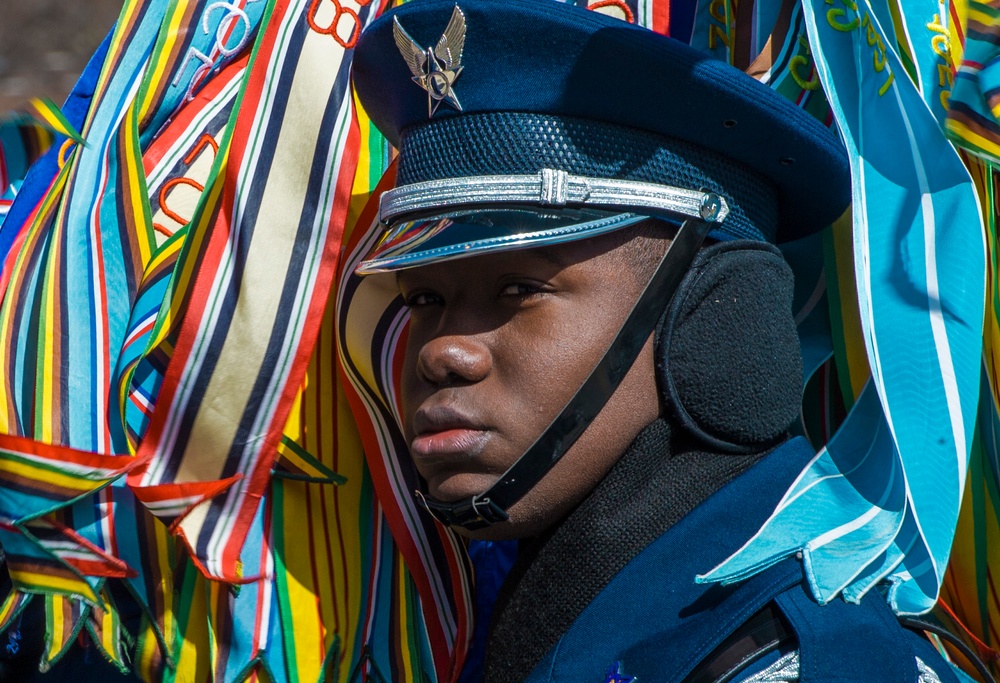 Ceremonial Guardsman peers through colorful streamers