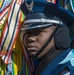 Ceremonial Guardsman peers through colorful streamers