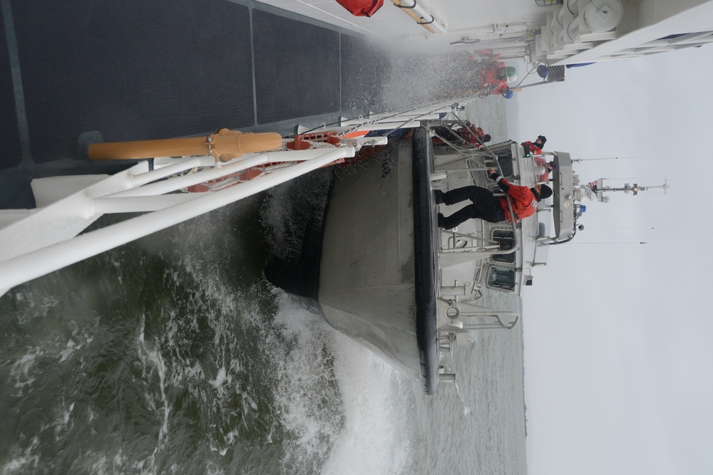 47-foot Motor Lifeboat comes alongside the Cutter John McCormick