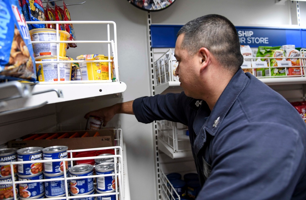 USS Wayne E. Meyer Sailor Puts Product in Store