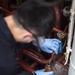 Engineering department boiler maintenance and nightly oil check aboard USS Bonhomme Richard