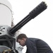 Fire Controlman 2nd Class Michael Jordan cycles through dummy rounds on a Close-In Weapons System (CIWS)