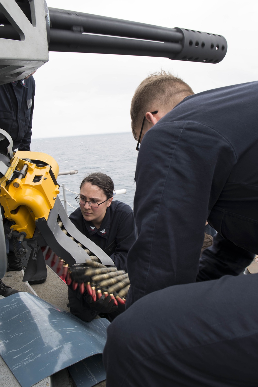 Fire Controlman 3rd Class Alexandria Ricalde, loads MK 244 20mm rounds into a CIWS