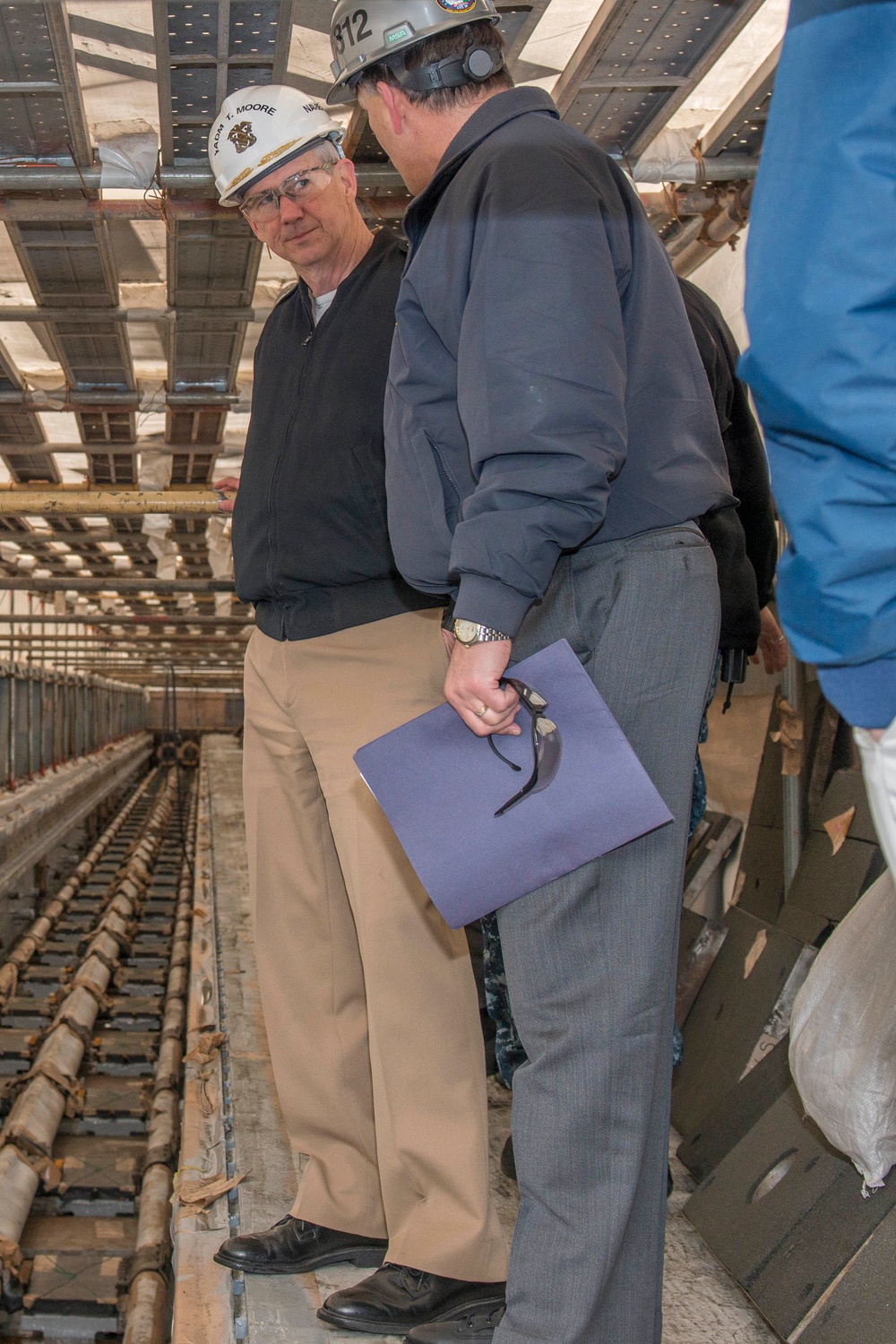 Paul Skogerboe Shows Vice Adm. Thomas J. Moore the Catapult