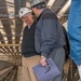 Paul Skogerboe Shows Vice Adm. Thomas J. Moore the Catapult