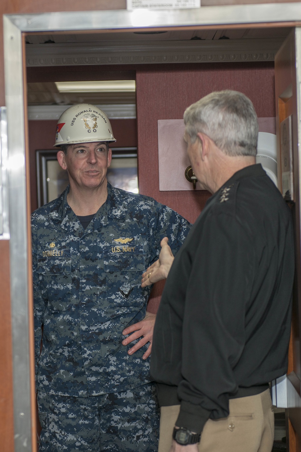 Capt. Buzz Donnelly Talks With Vice Adm. Thomas J. Moore