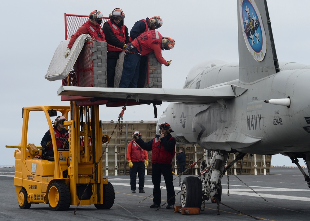 Sailors lifted by forklift